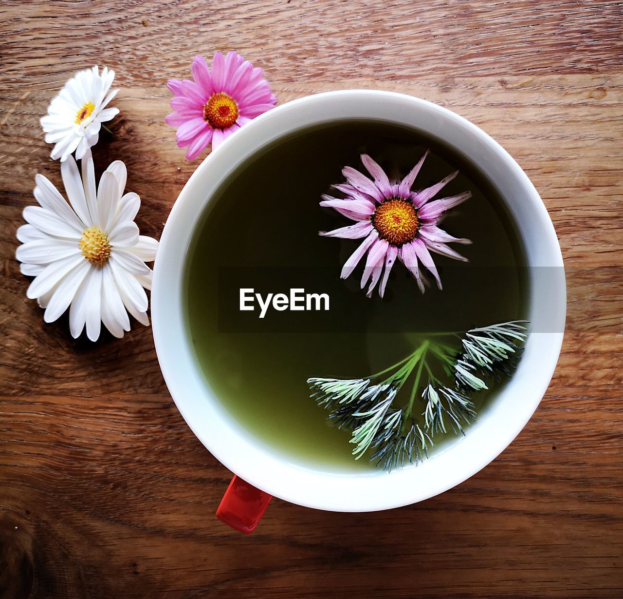 Green matcha tea with edible flowers