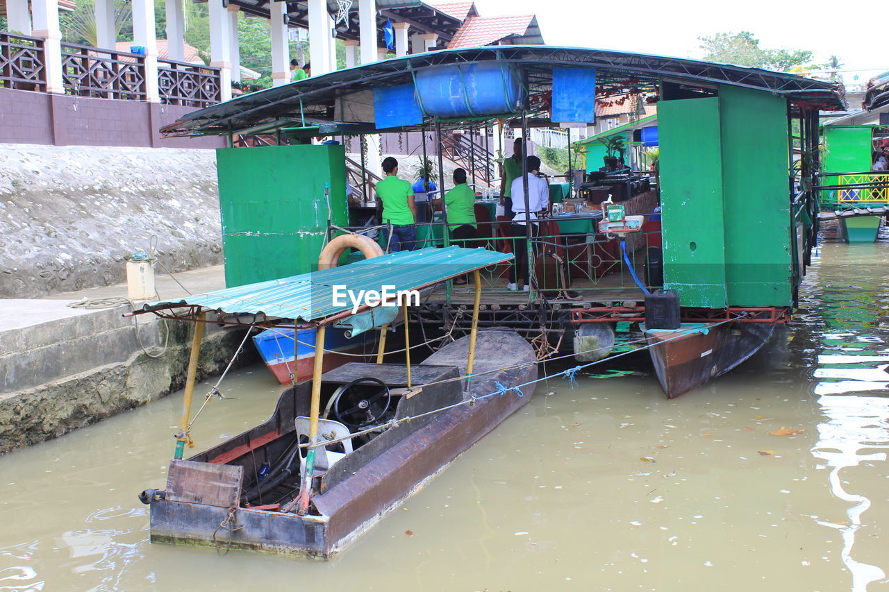 SHIP MOORED IN CANAL