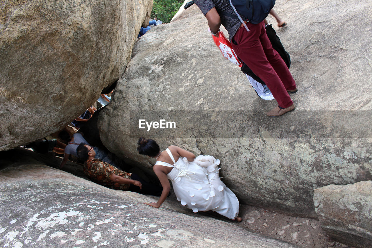 LOW SECTION OF WOMEN ON ROCKS