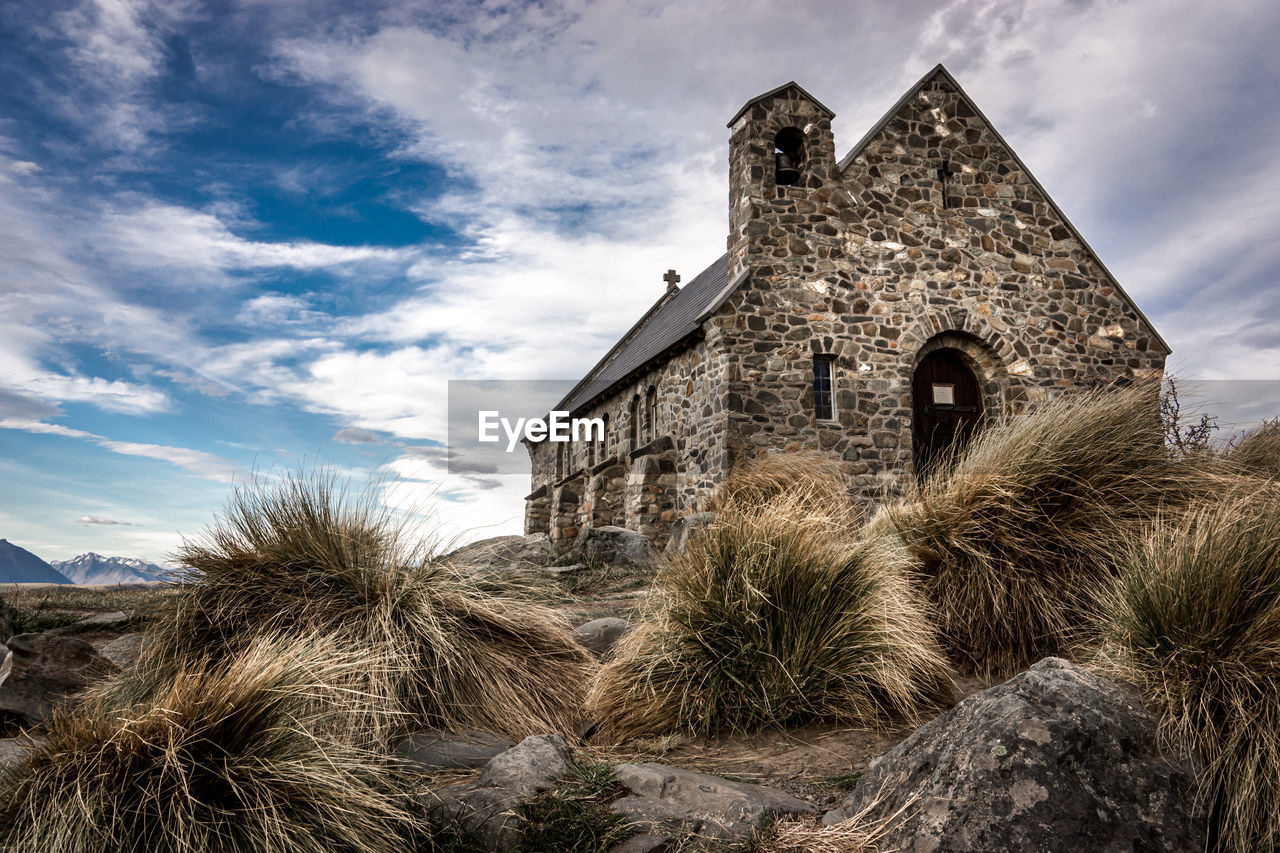 Low angle view of old building against sky, church.