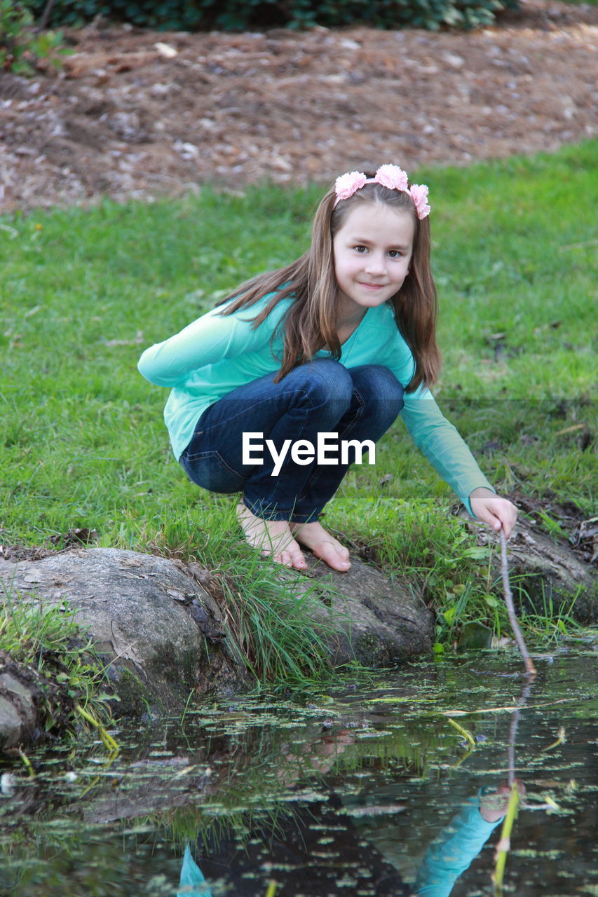 PORTRAIT OF GIRL IN LAKE