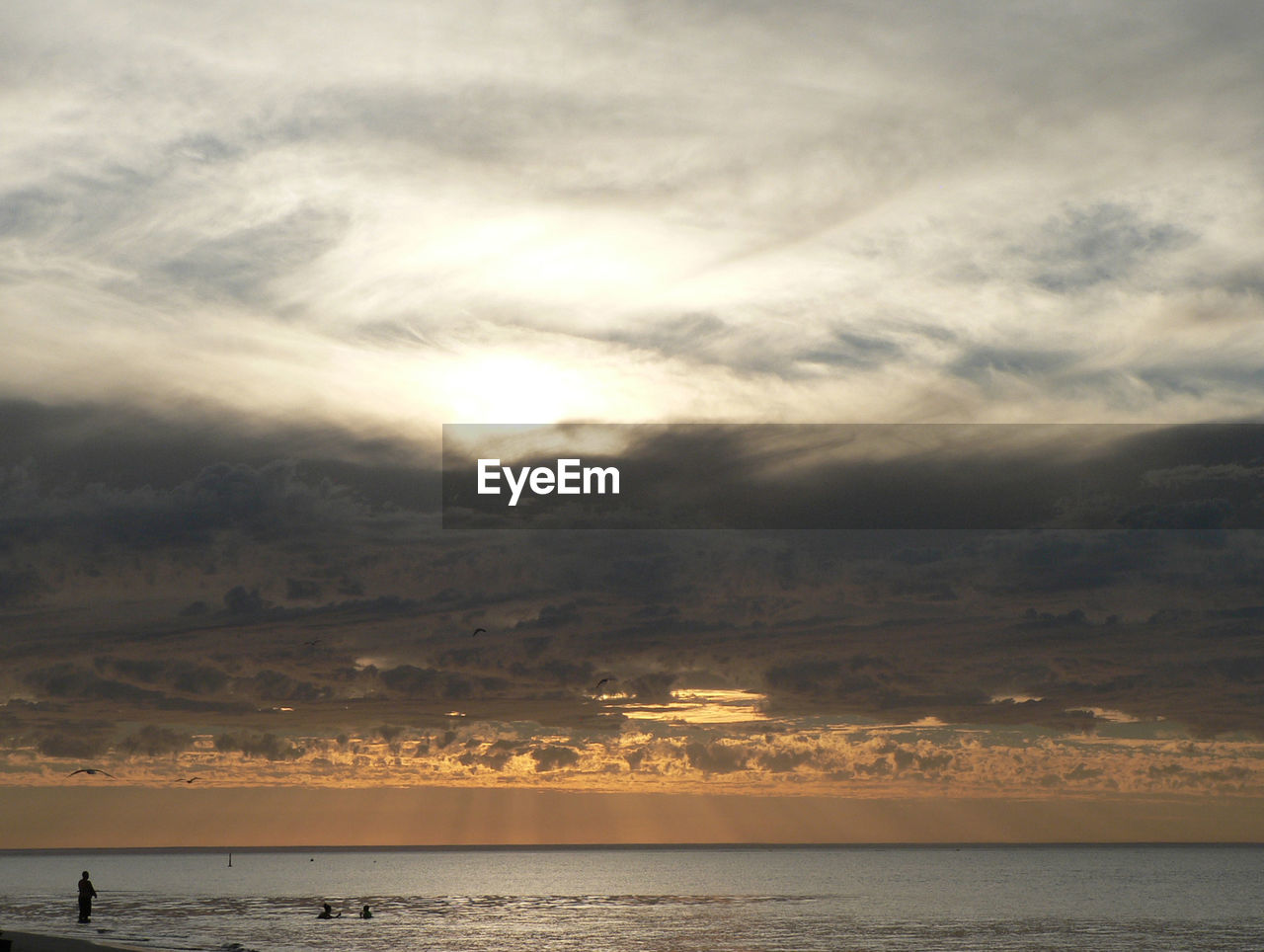 Scenic view of sea against sky at sunset