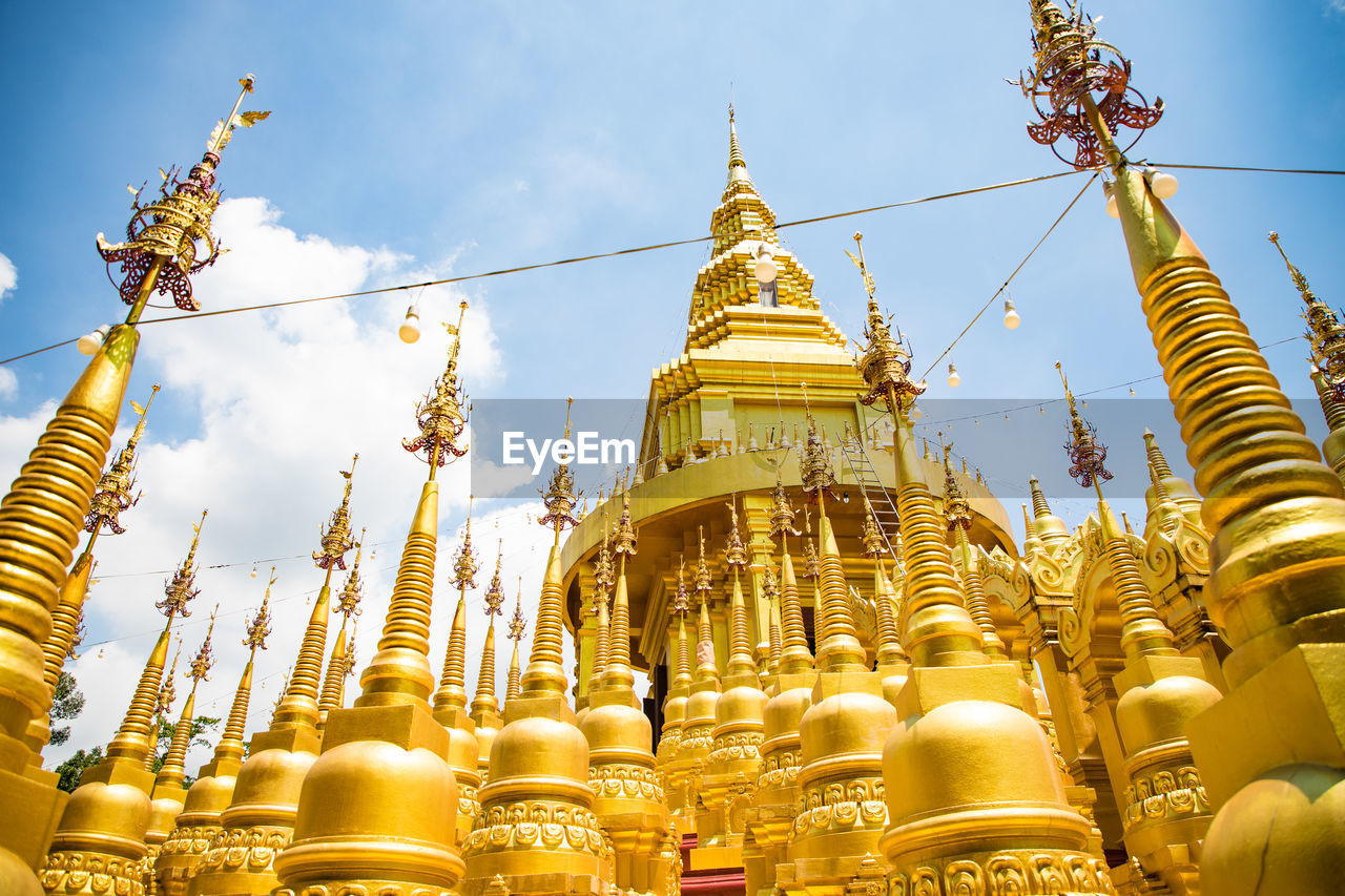 LOW ANGLE VIEW OF TEMPLE AGAINST BUILDINGS