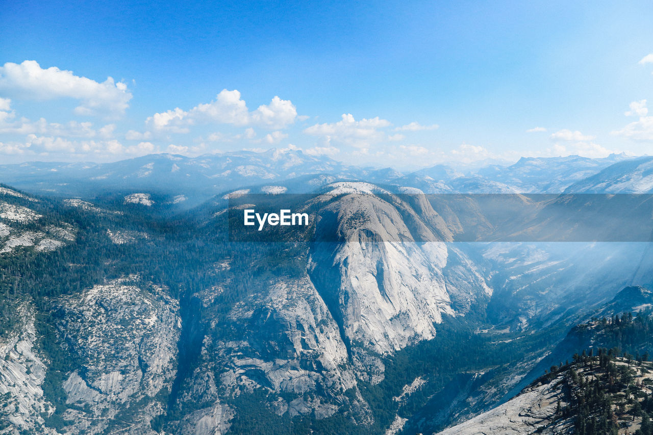 Aerial view of snowcapped mountains against sky
