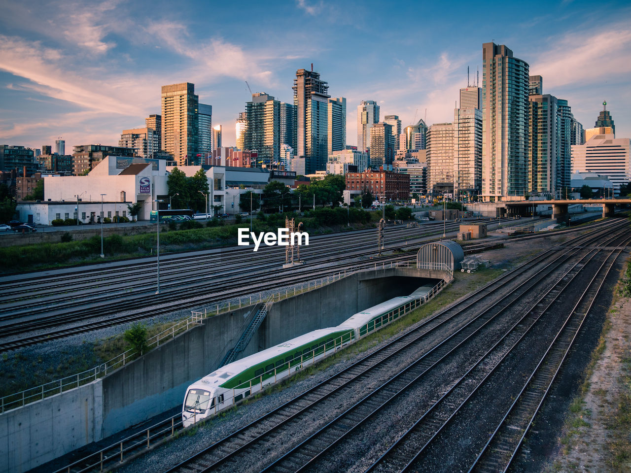 High angle view of train on tracks against buildings