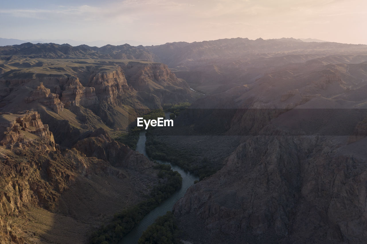 Aerial view of the charyn canyon and charyn river in kazakhstan, bestamak camping site, at sunset