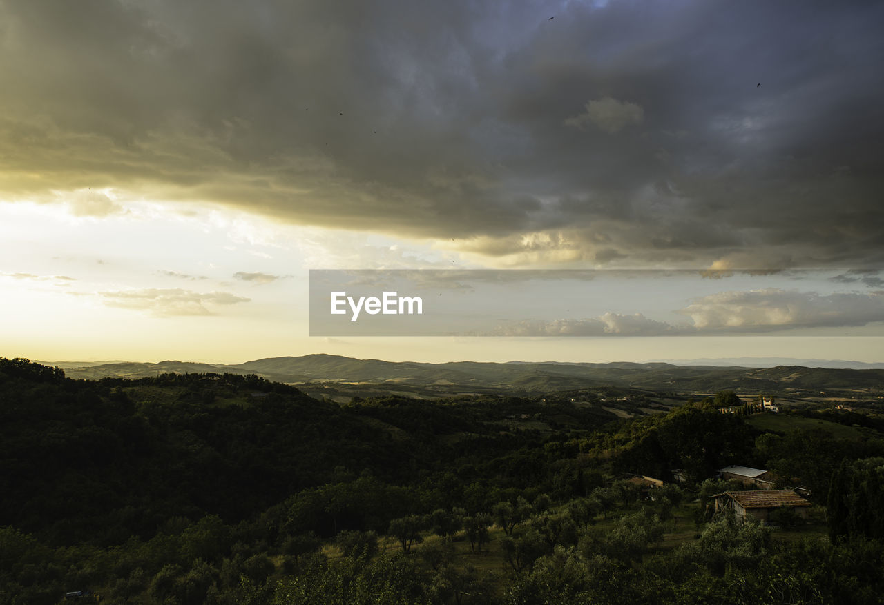 SCENIC VIEW OF LAND AGAINST SKY DURING SUNSET