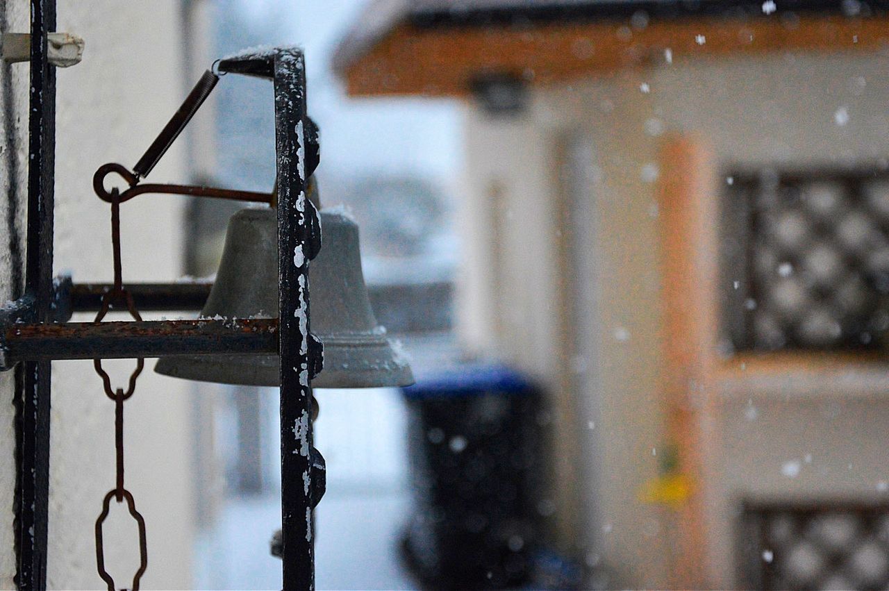 Close-up of bell during snow fall