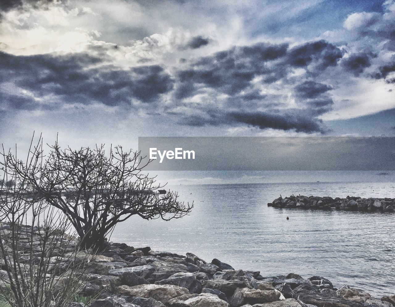 VIEW OF SEA AGAINST CLOUDY SKY