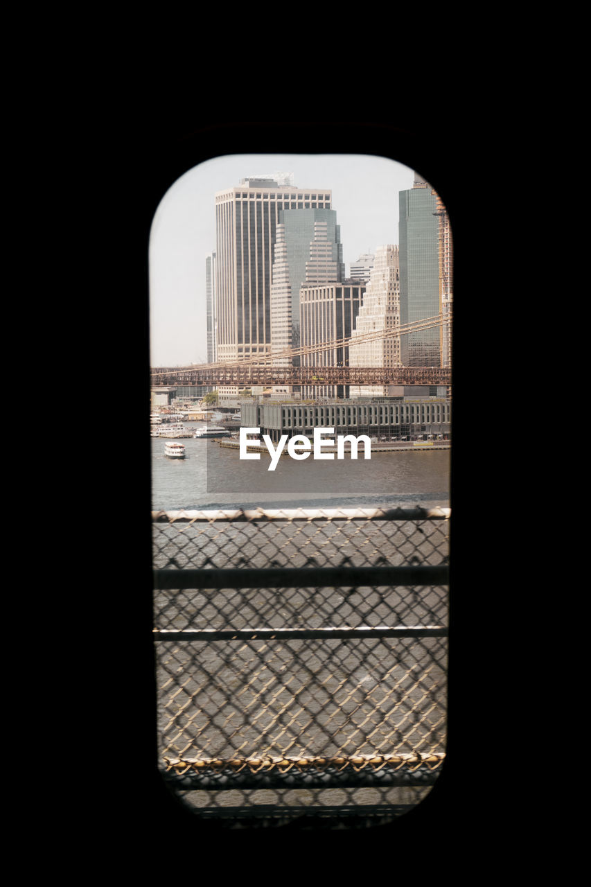 Buildings in city seen through window