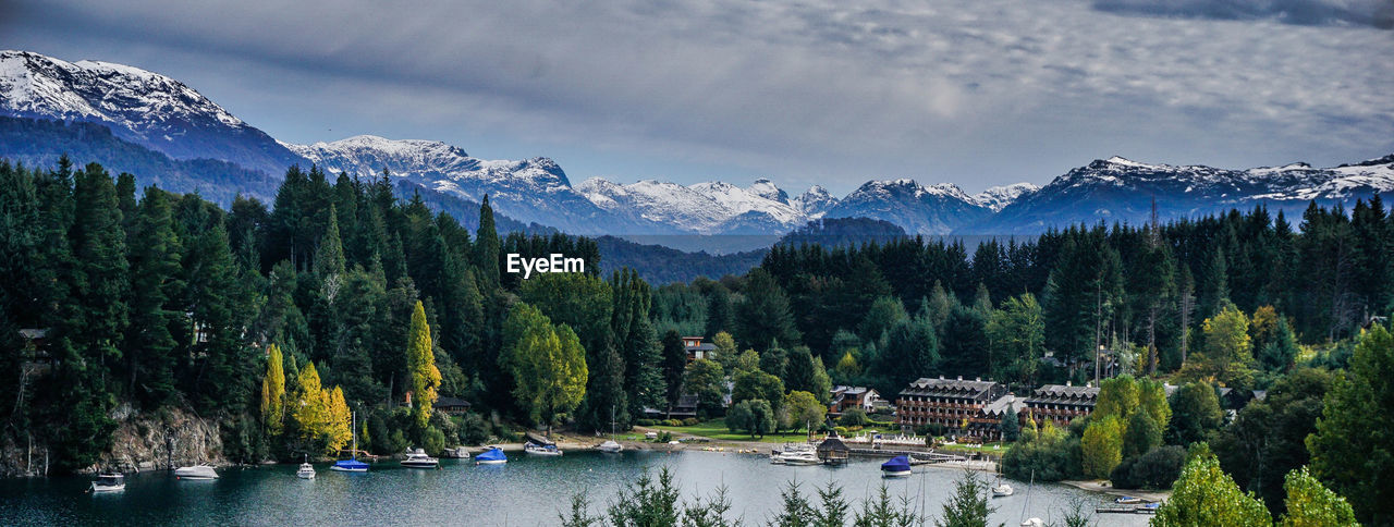 Panoramic view of trees and mountains against sky