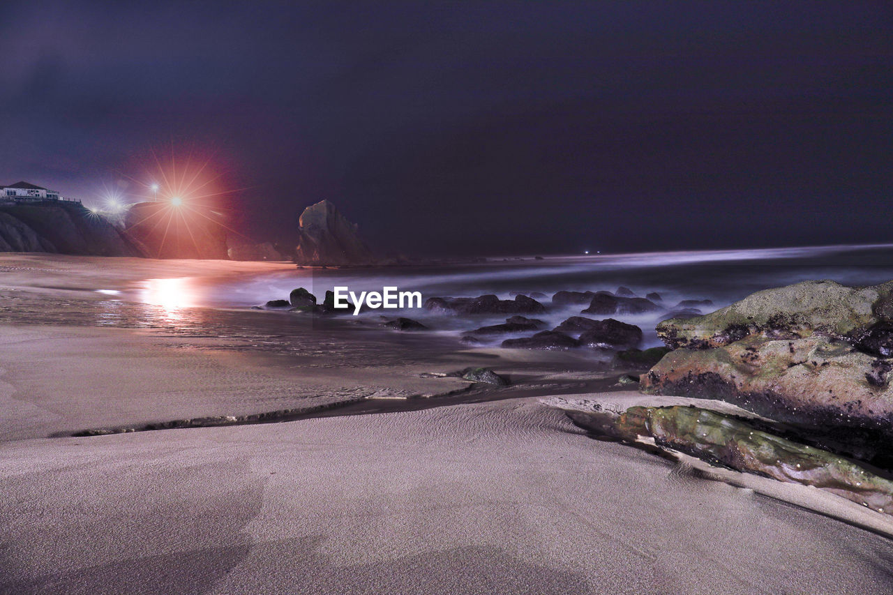 PANORAMIC VIEW OF SEA AGAINST SKY AT NIGHT