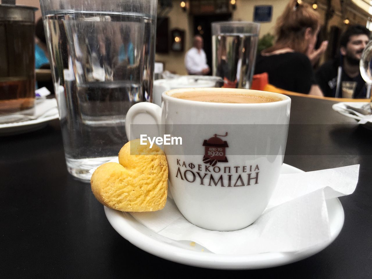 CLOSE-UP OF COFFEE CUP ON TABLE