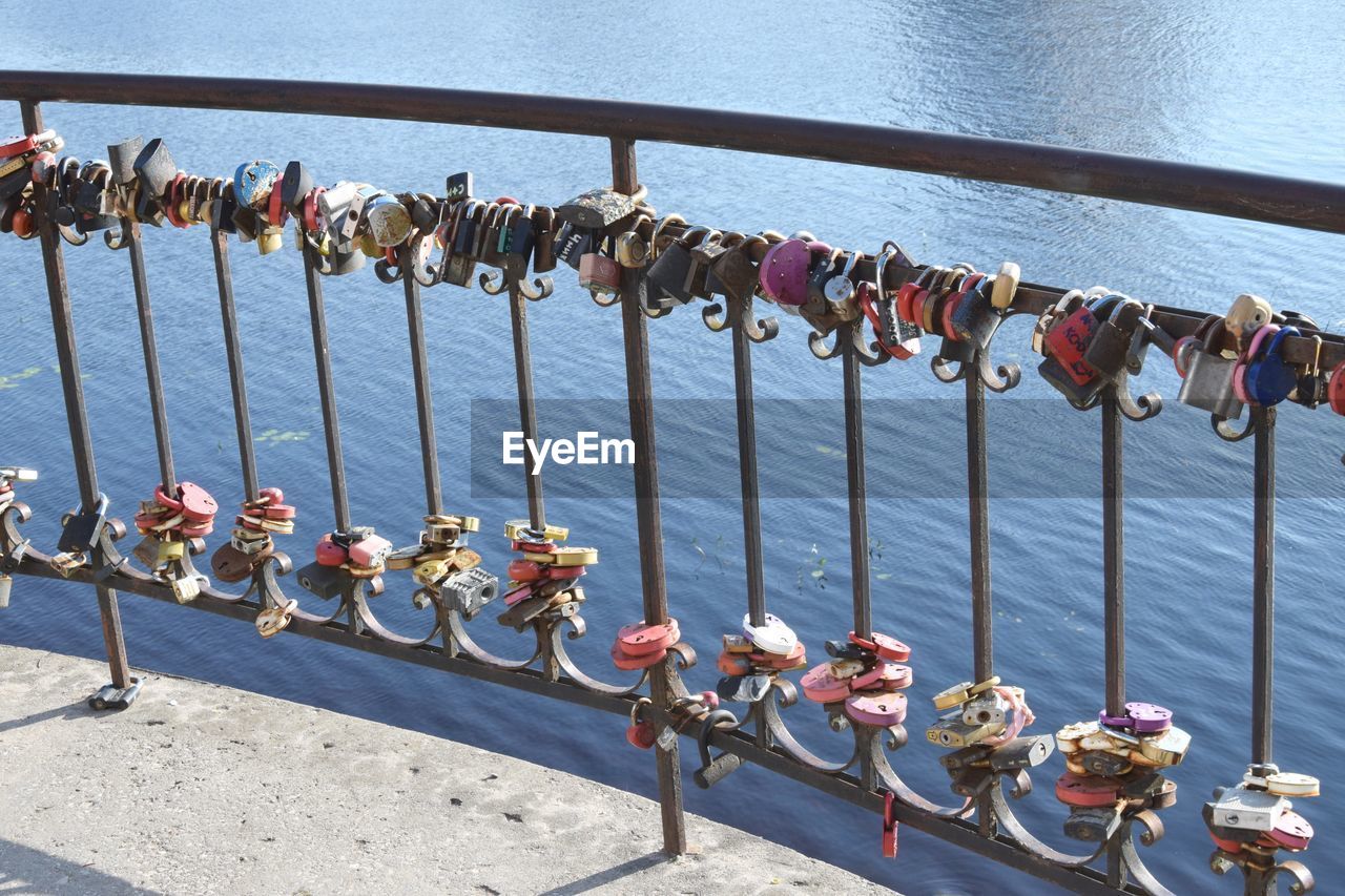 PADLOCKS HANGING ON RAILING