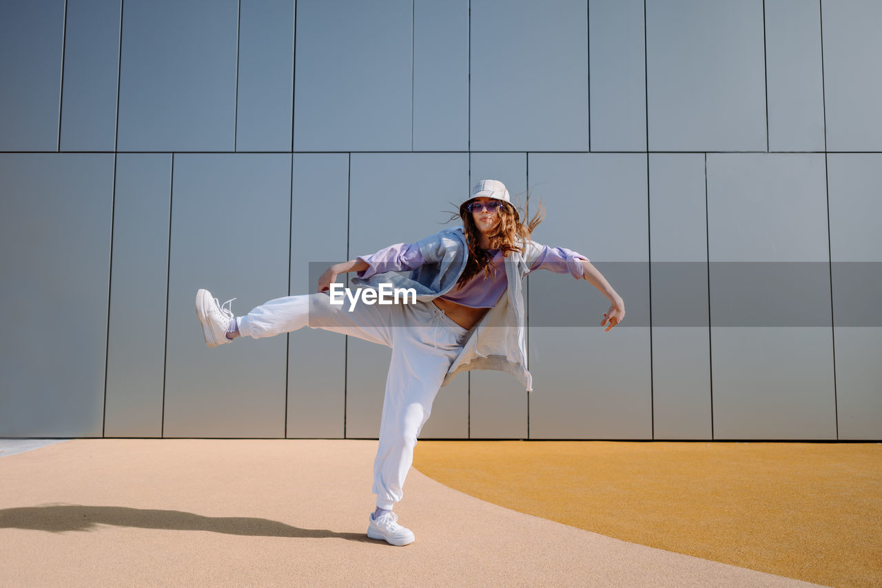 Dancing girl funny break dance, happy rhythmically waving. breakdancing, street dancing, hiphop