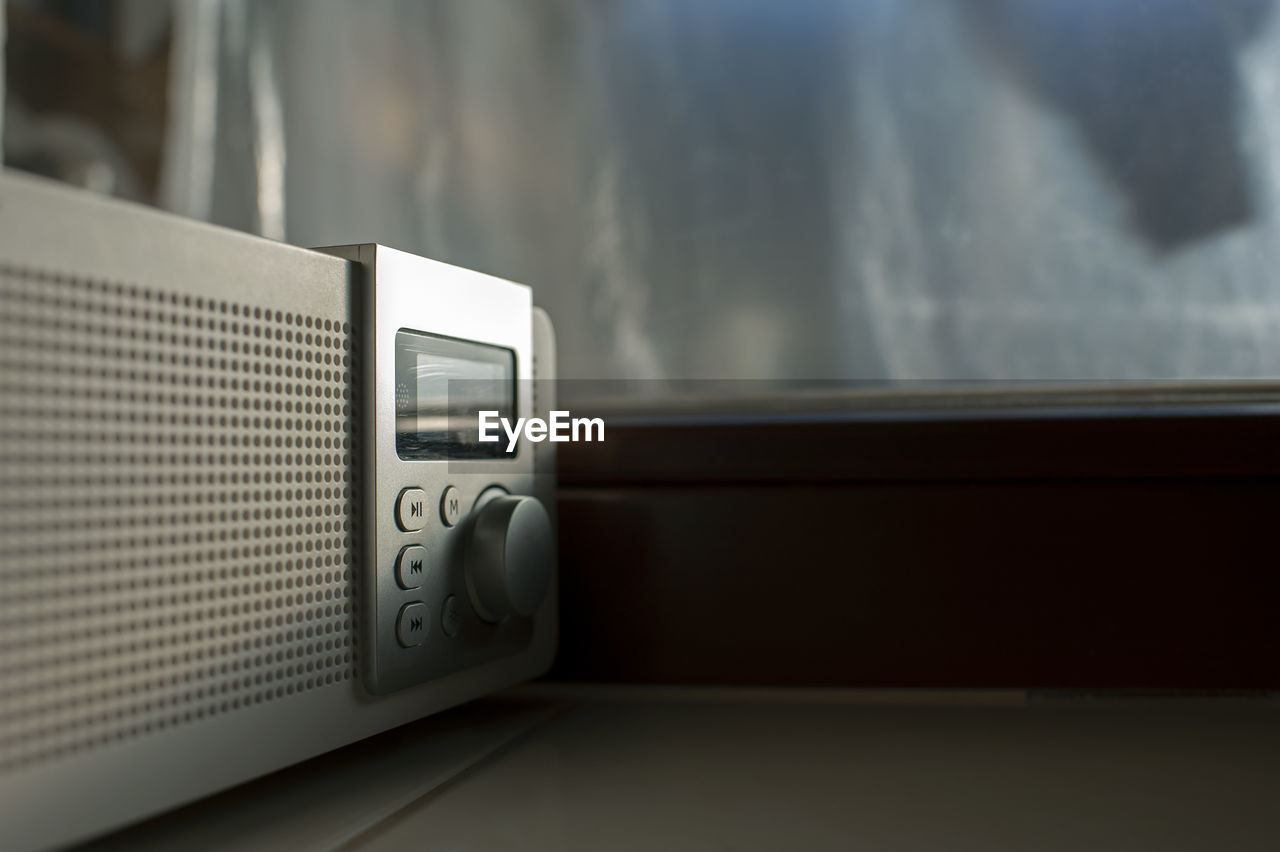 Alarm clock radio with the early hour on the windowsill display