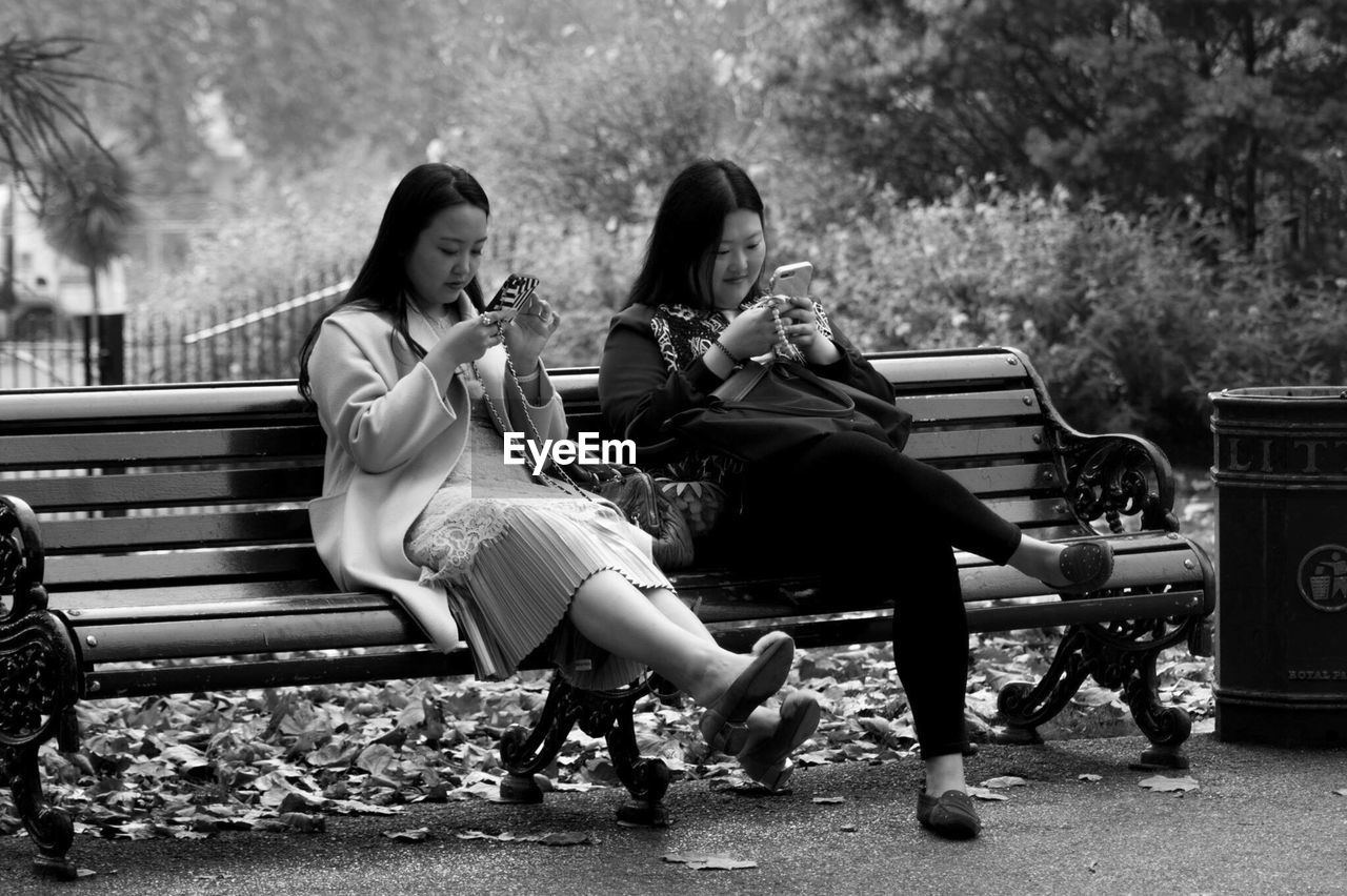 WOMEN SITTING ON PARK