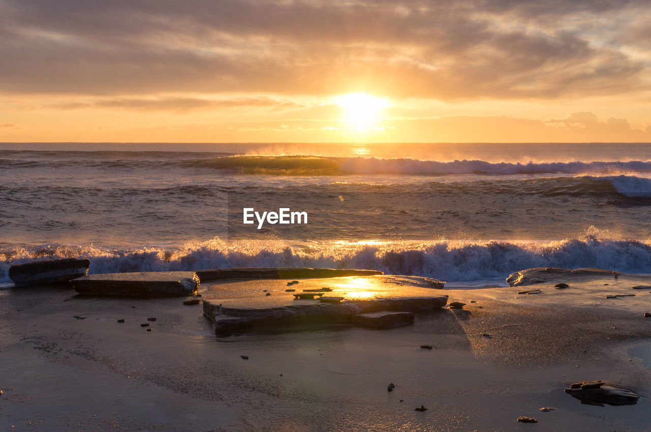 Scenic view of sea against sky during sunset