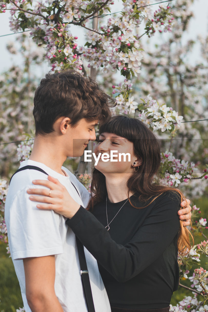 Candid portrait of a love couple in autumn time. smile of a young couple