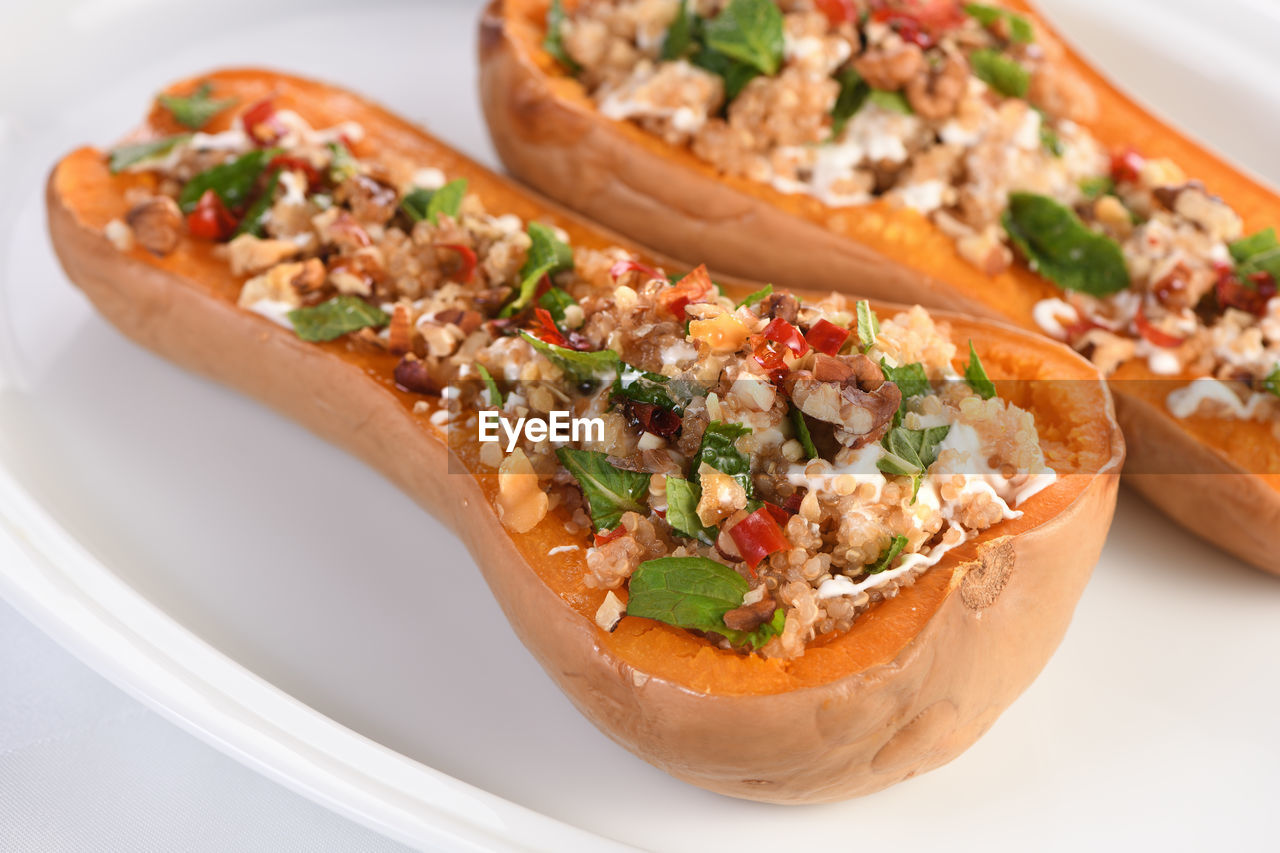 Baked stuffed pumpkin filled with walnuts, fresh mint and chili with quinoa tabbouleh.  