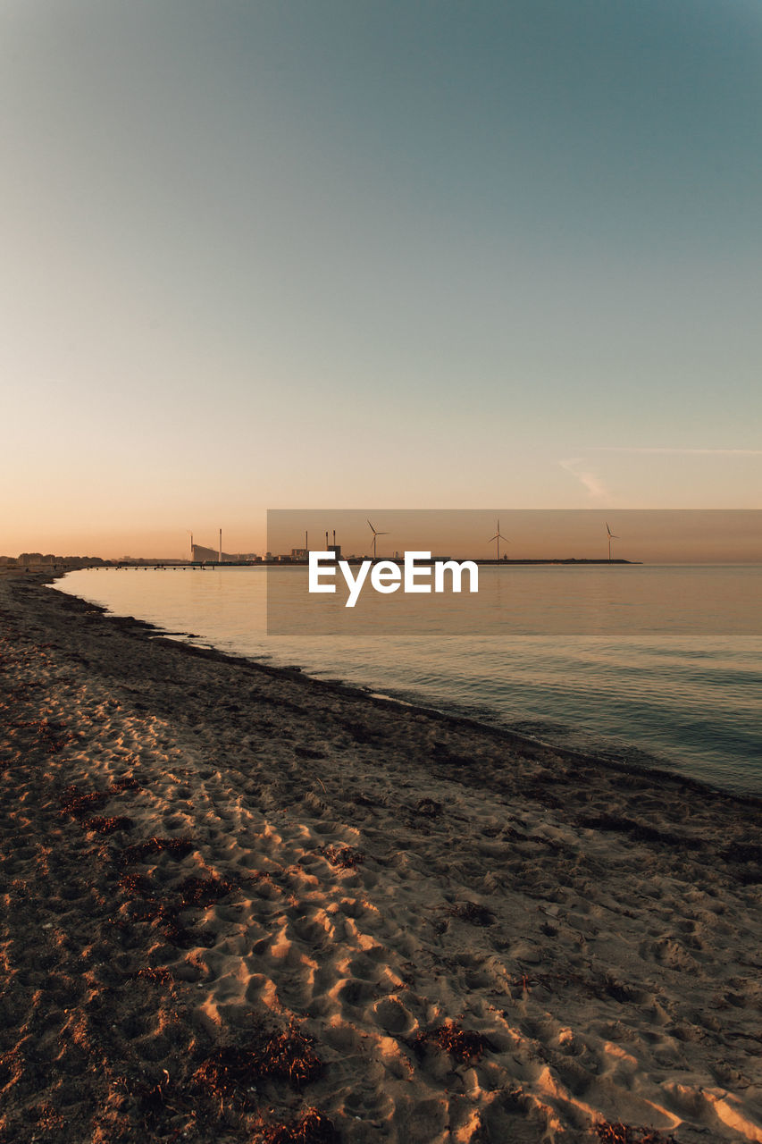 Scenic view of sea against clear sky during sunset