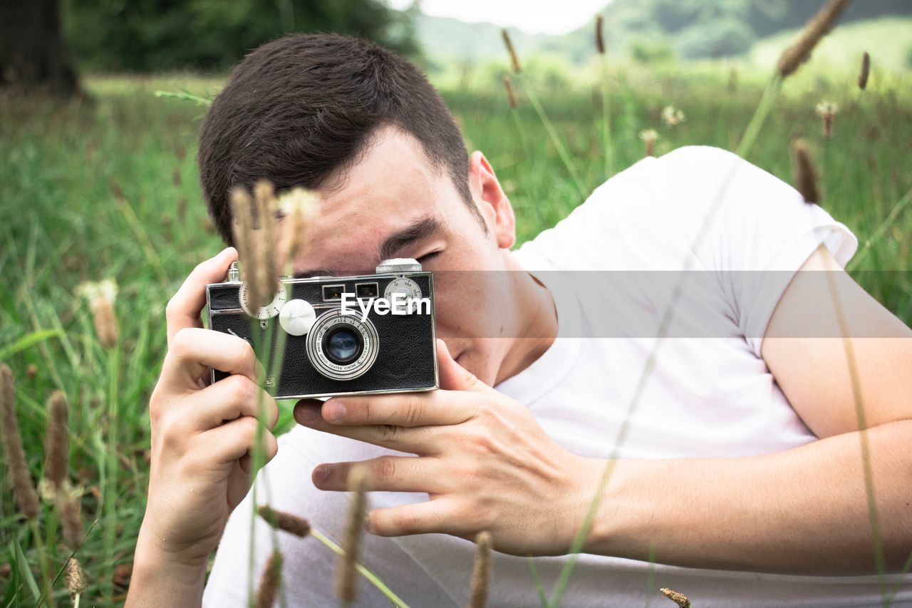 Man photographing plants with camera