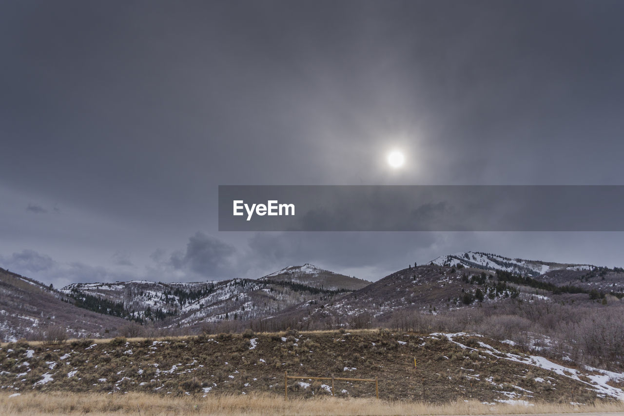 Scenic view of landscape against sky at night