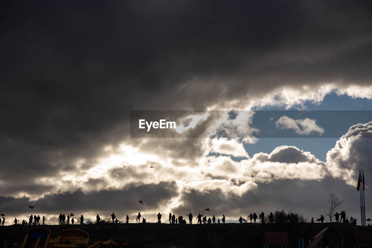 PANORAMIC SHOT OF SILHOUETTE BUILDINGS IN CITY