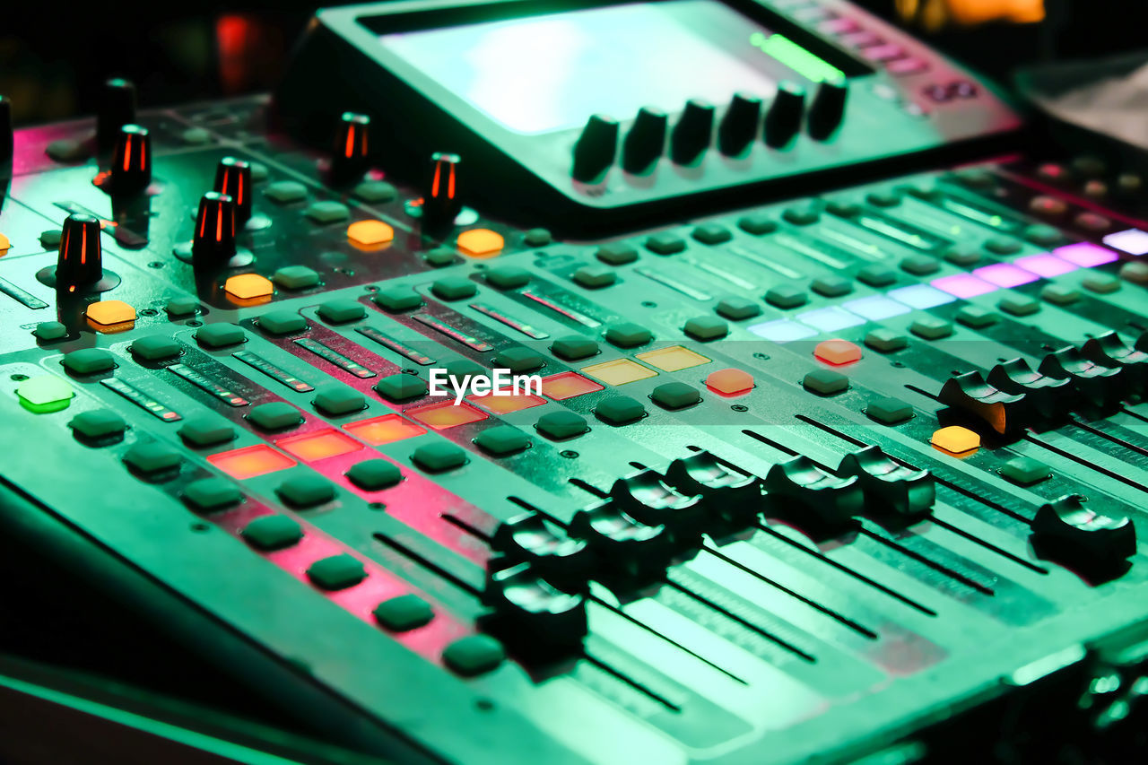 Closeup of an audio mixing control panel