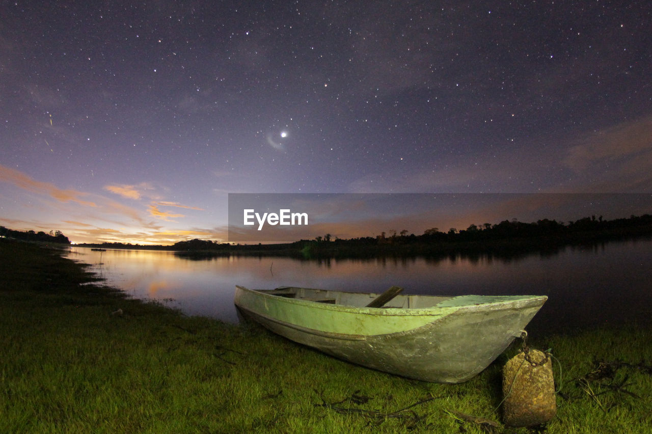 Scenic view of lake at night