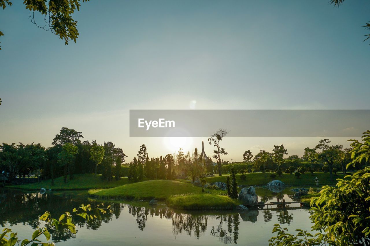 Scenic view of lake against sky during sunset