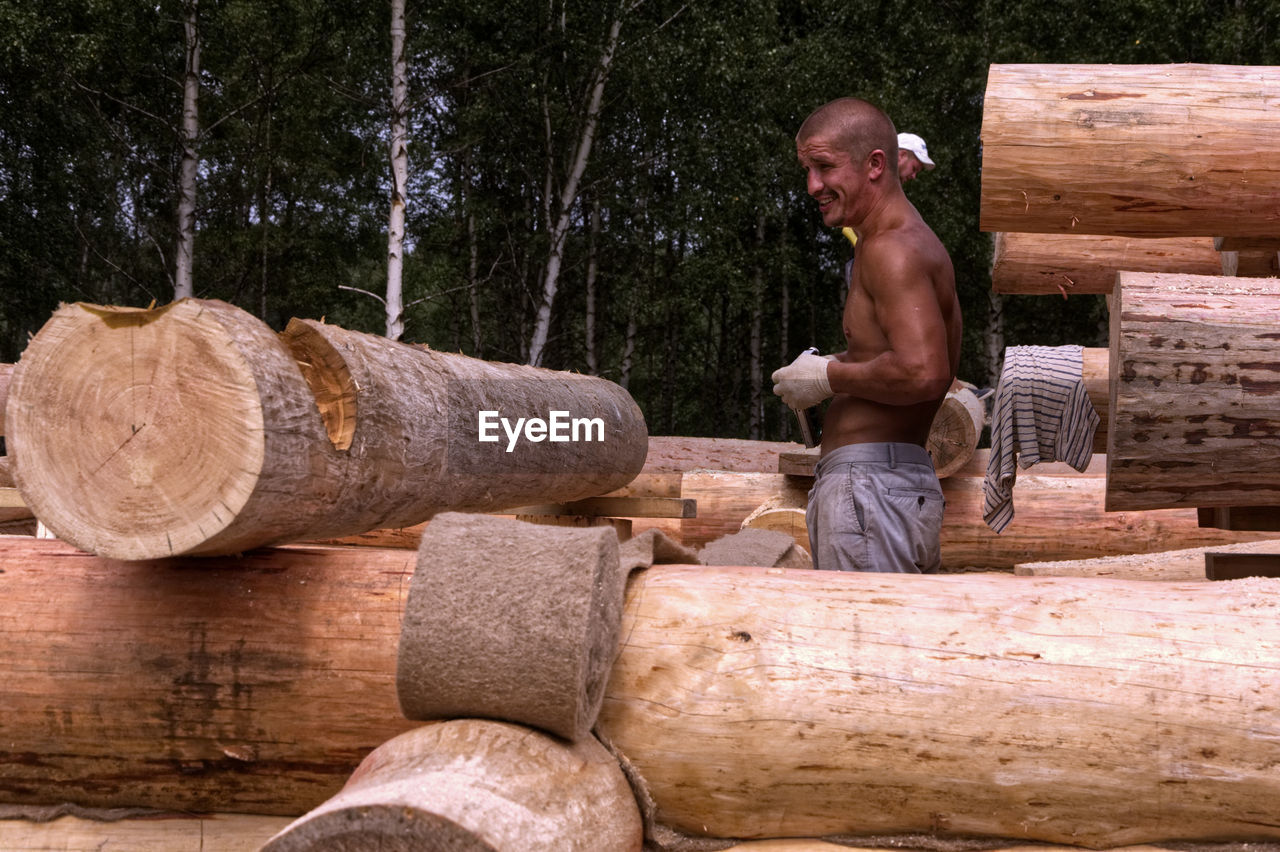 FULL LENGTH OF MAN WORKING ON WOOD