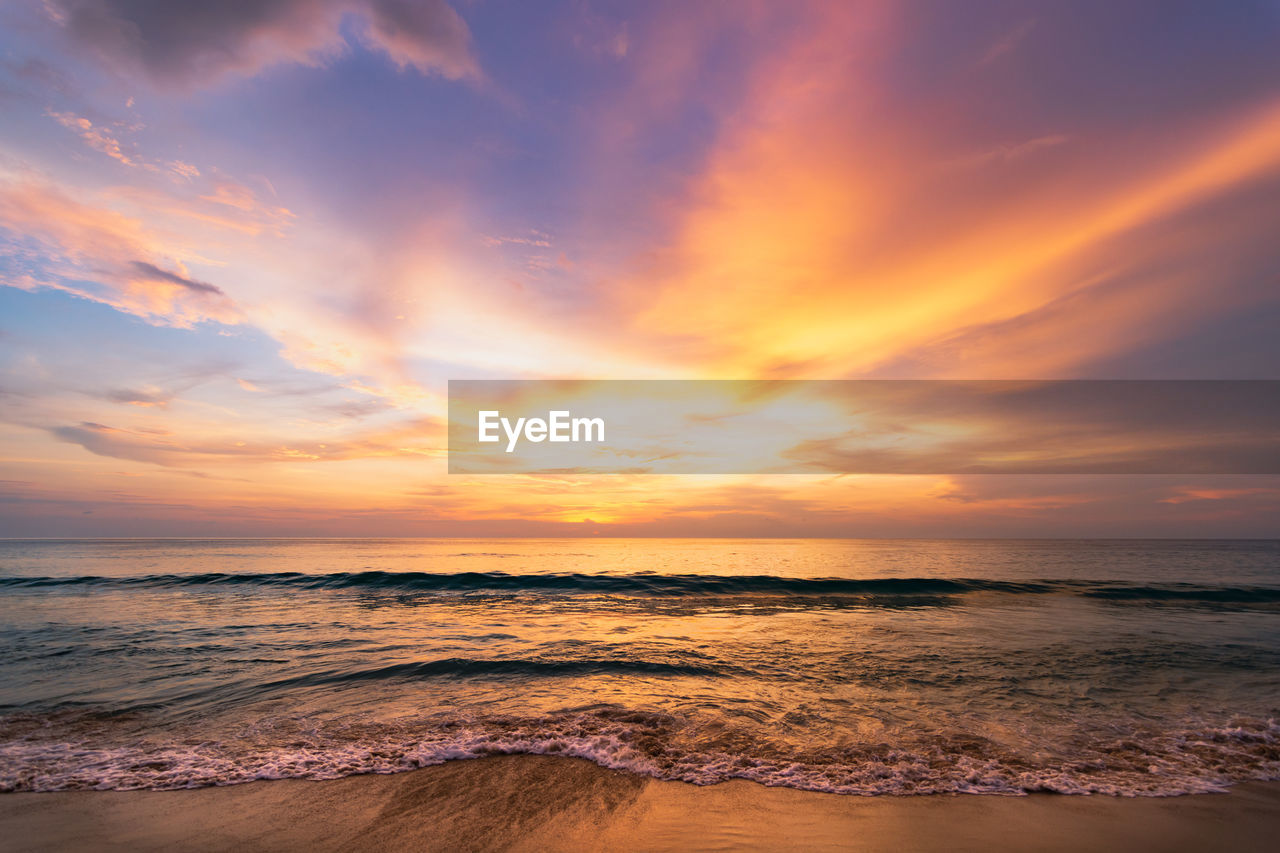 SCENIC VIEW OF SUNSET OVER SEA