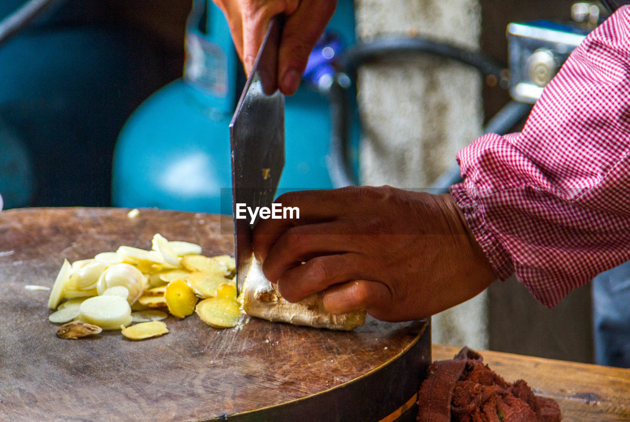 Close-up of man preparing food