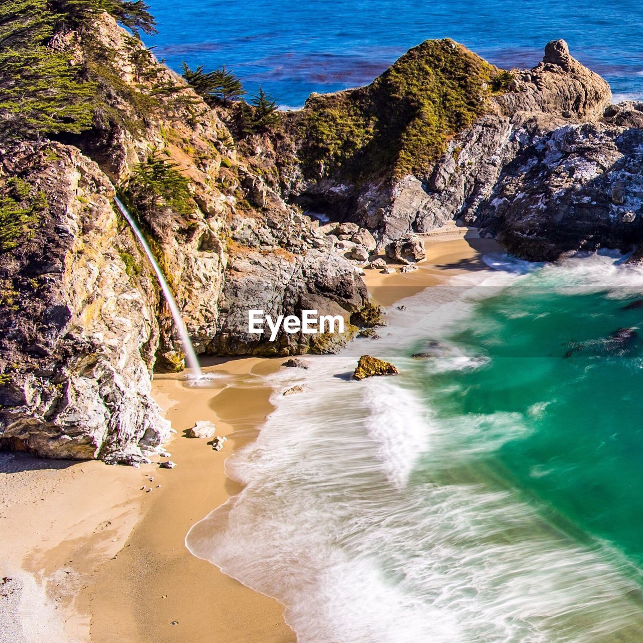 High angle view of rock formations on beach