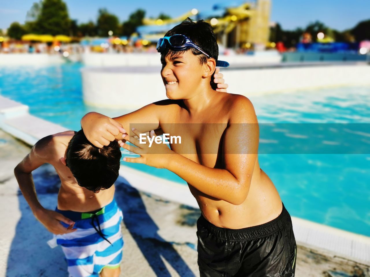 Friends playing  in swimming pool