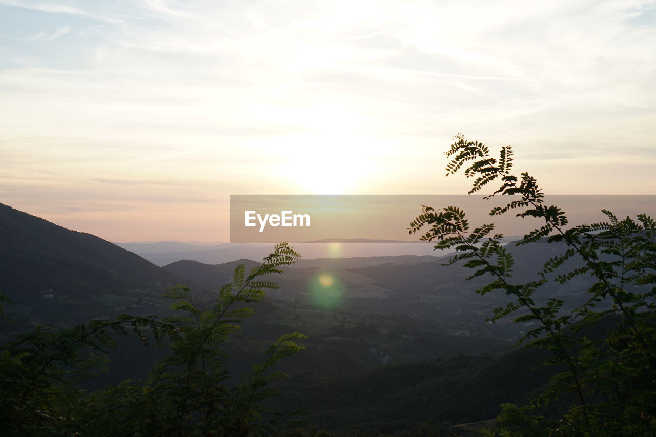 Scenic view of landscape against sky during sunset