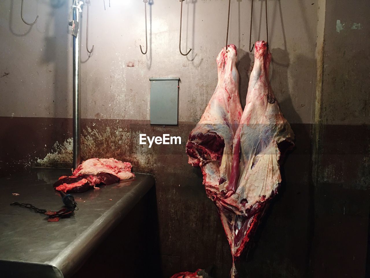 Meat hanging from hook at butcher shop