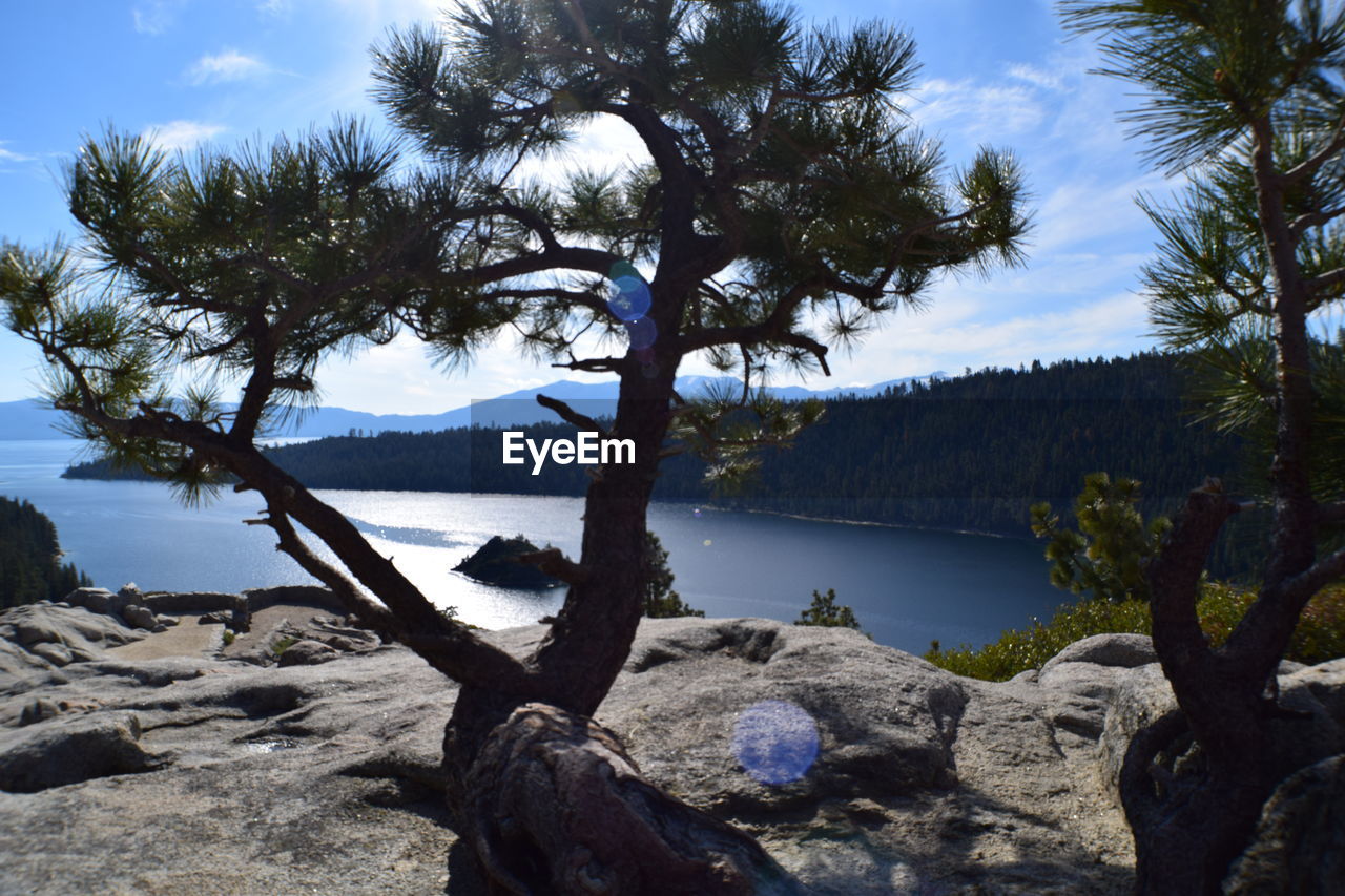 SCENIC VIEW OF LAKE AGAINST MOUNTAIN RANGE