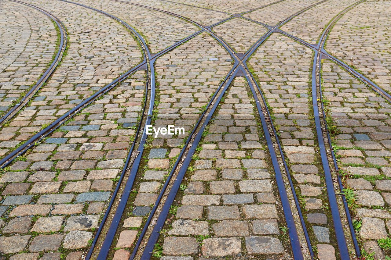 High angle view of tramway on cobblestone street