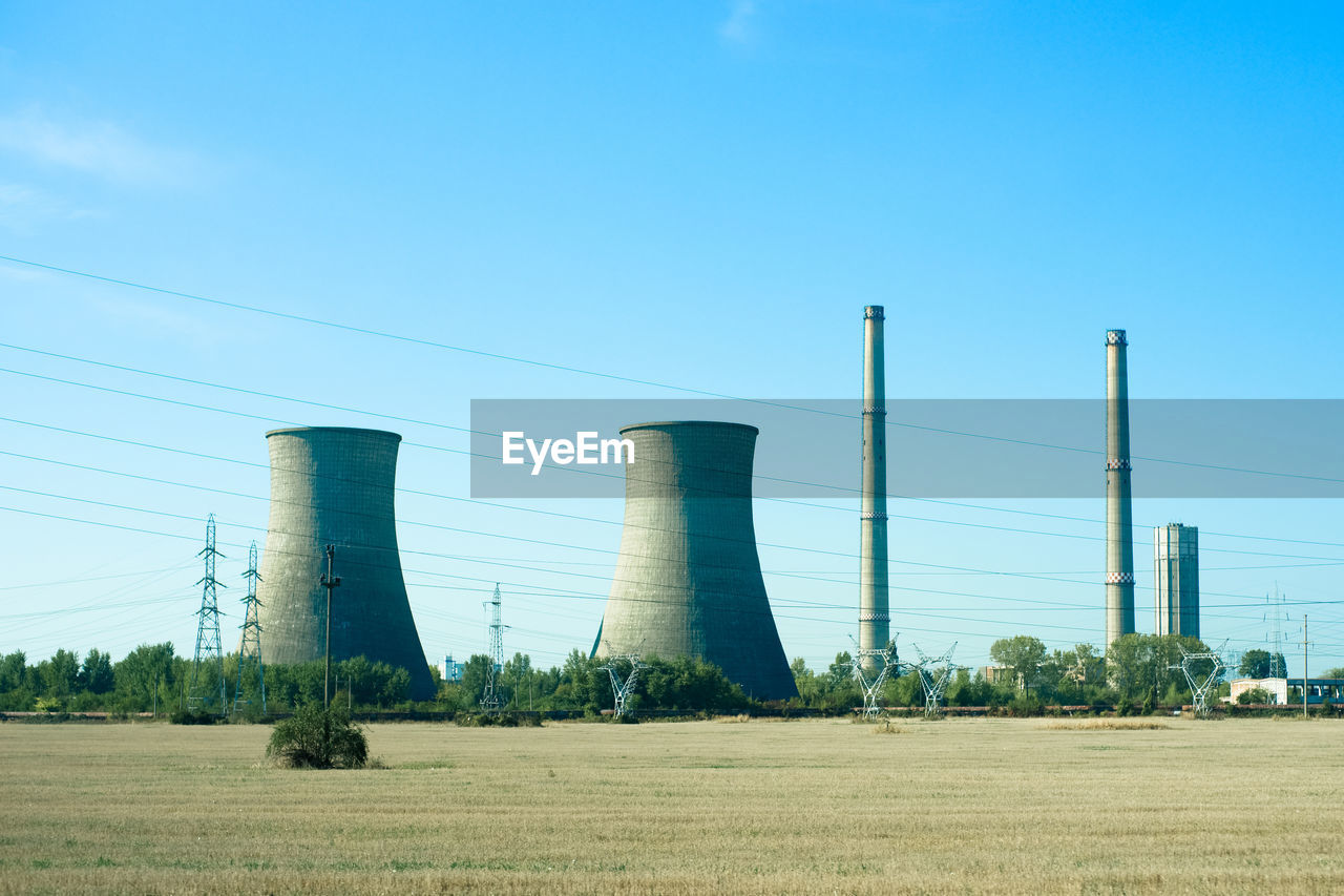 PANORAMIC VIEW OF FACTORY AGAINST SKY