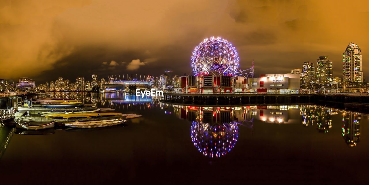 Illuminated modern buildings in city at night