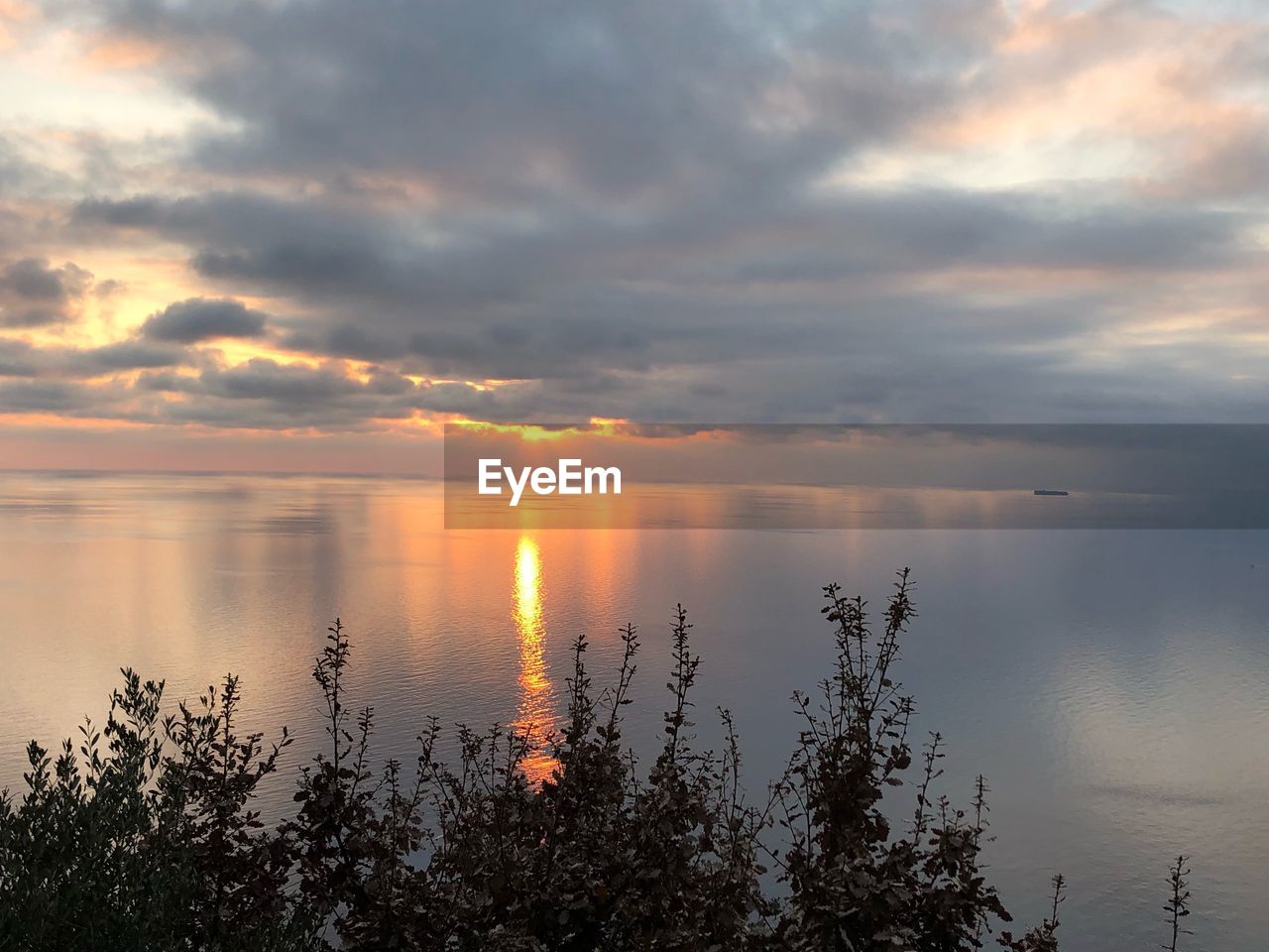 SCENIC VIEW OF LAKE DURING SUNSET