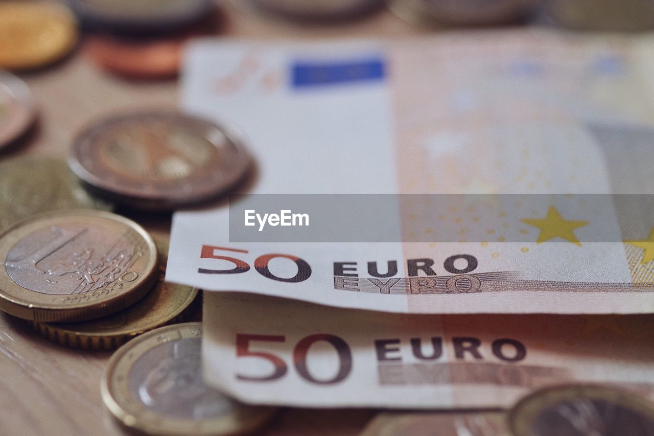 Close-up of european union currency on table