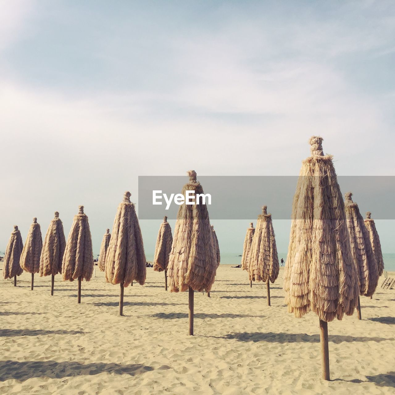 PANORAMIC VIEW OF UMBRELLAS HANGING ON BEACH