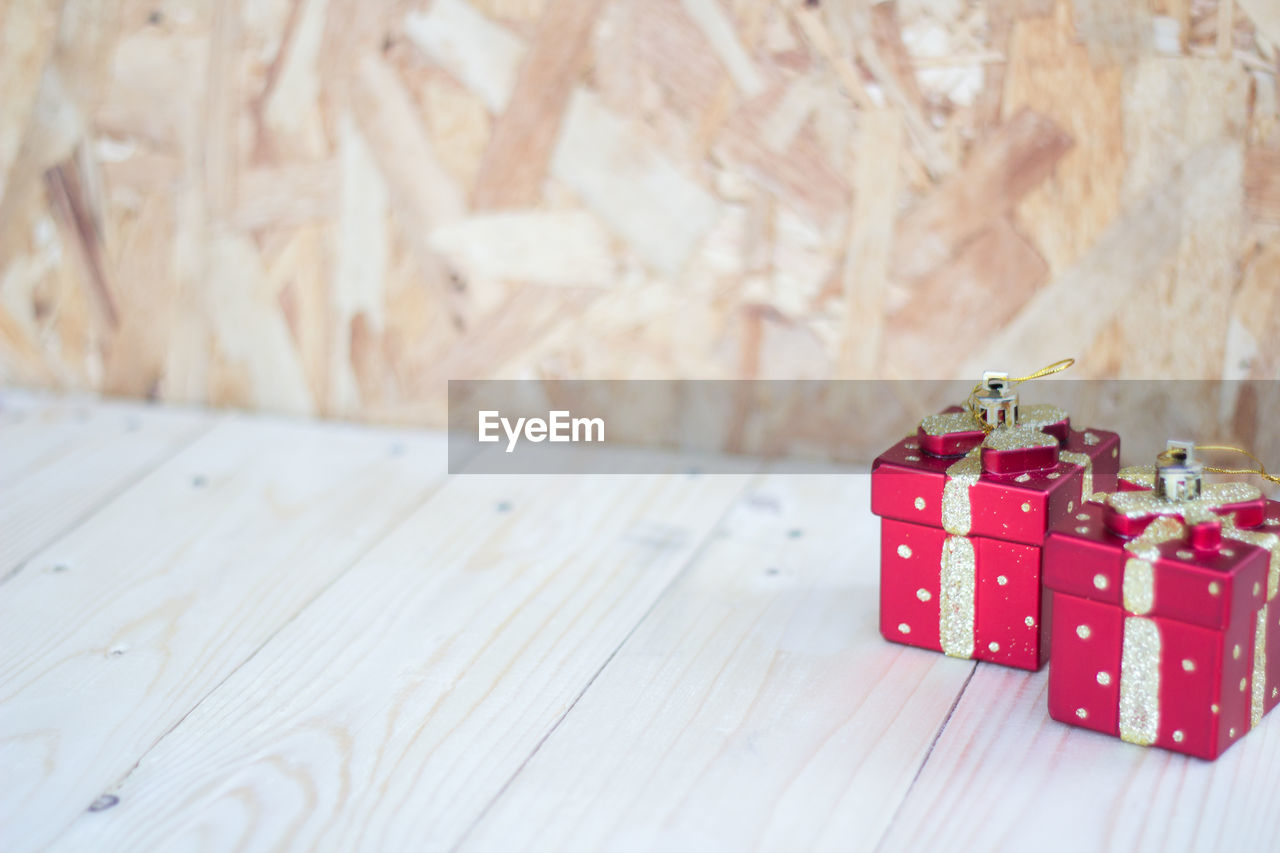 High angle view of red gift boxes on wooden table