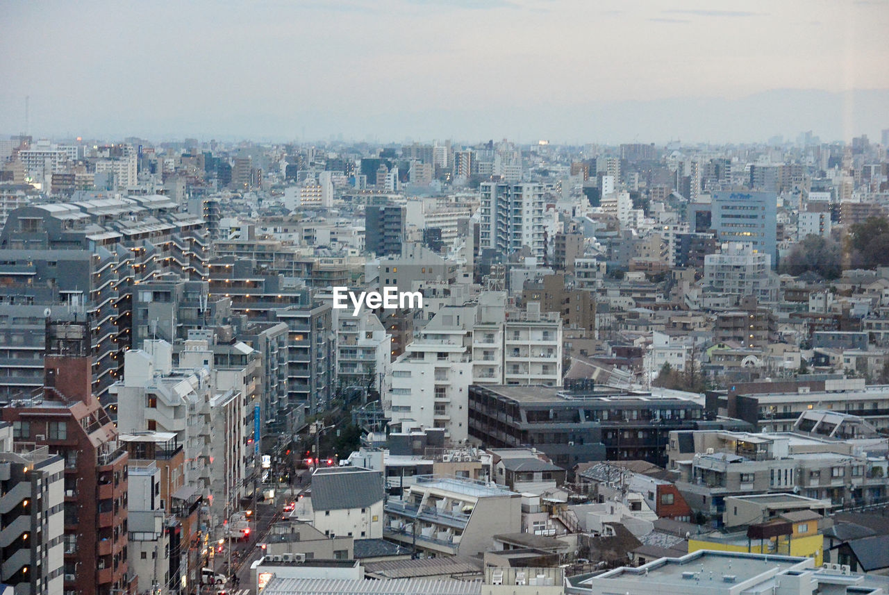 HIGH ANGLE VIEW OF BUILDINGS AGAINST SKY