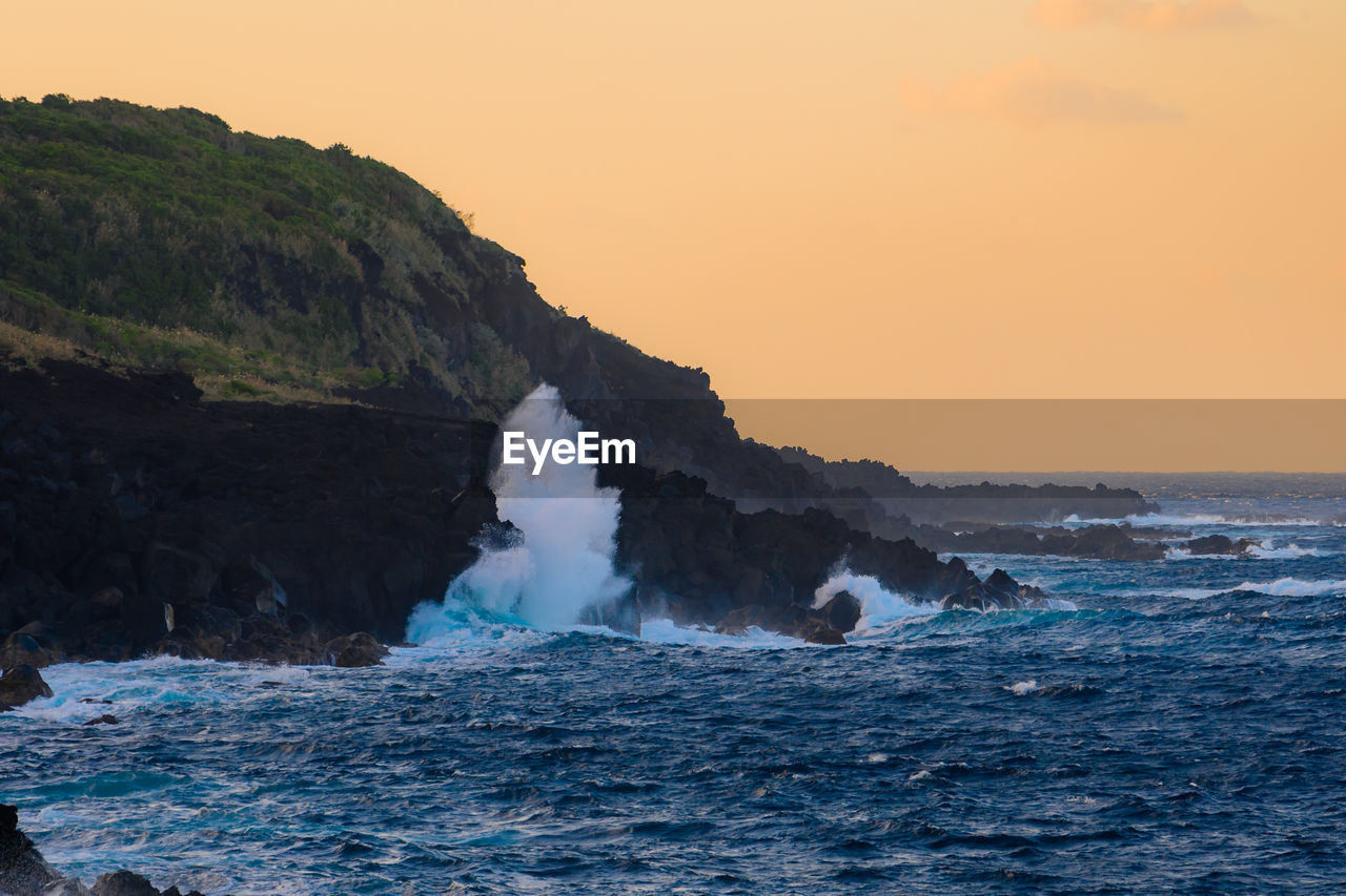 Scenic view of sea against sky during sunset