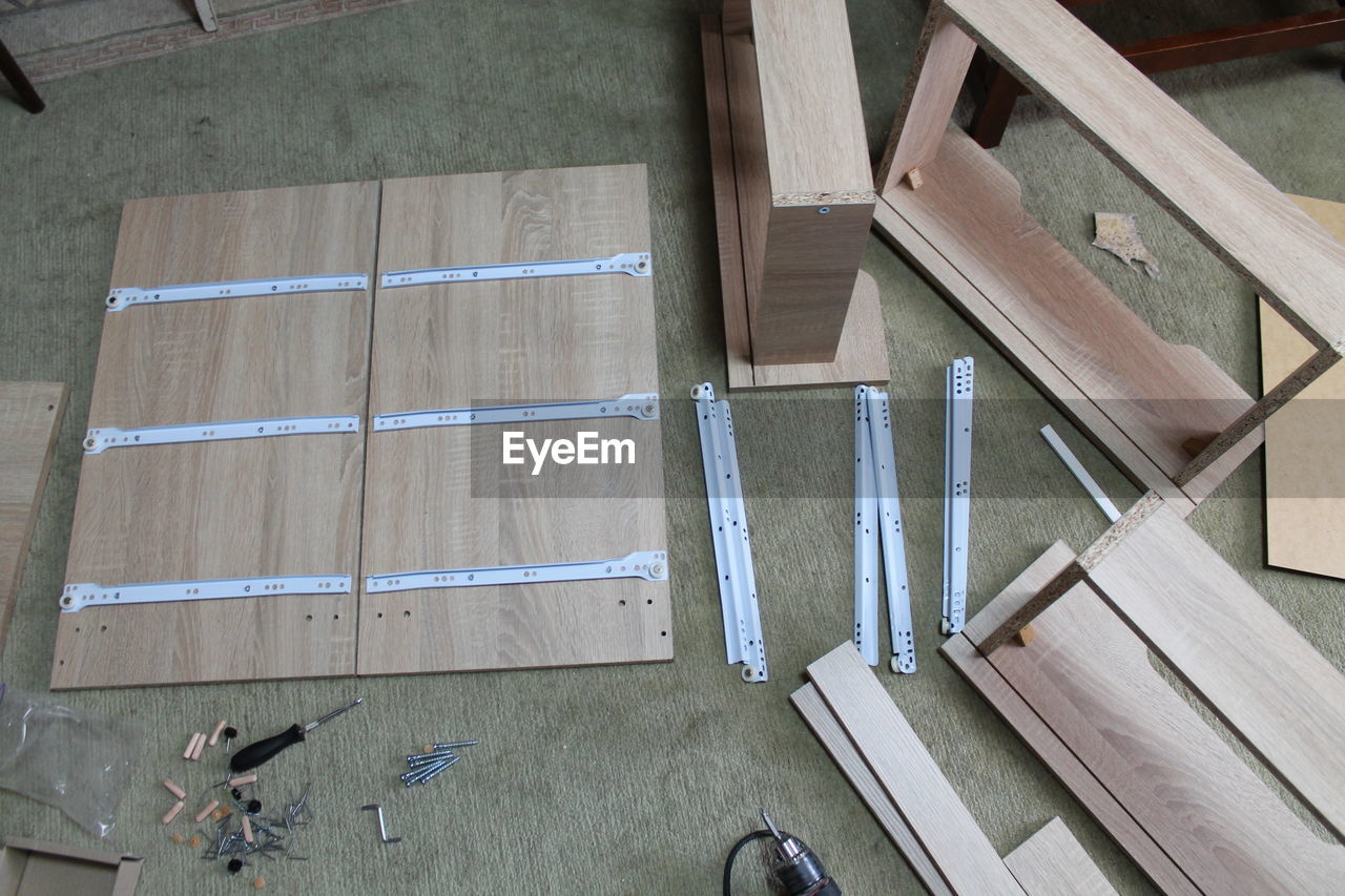 floor, high angle view, wood, architecture, flooring, indoors, roof, wall, built structure, day, directly above, no people, room, diy