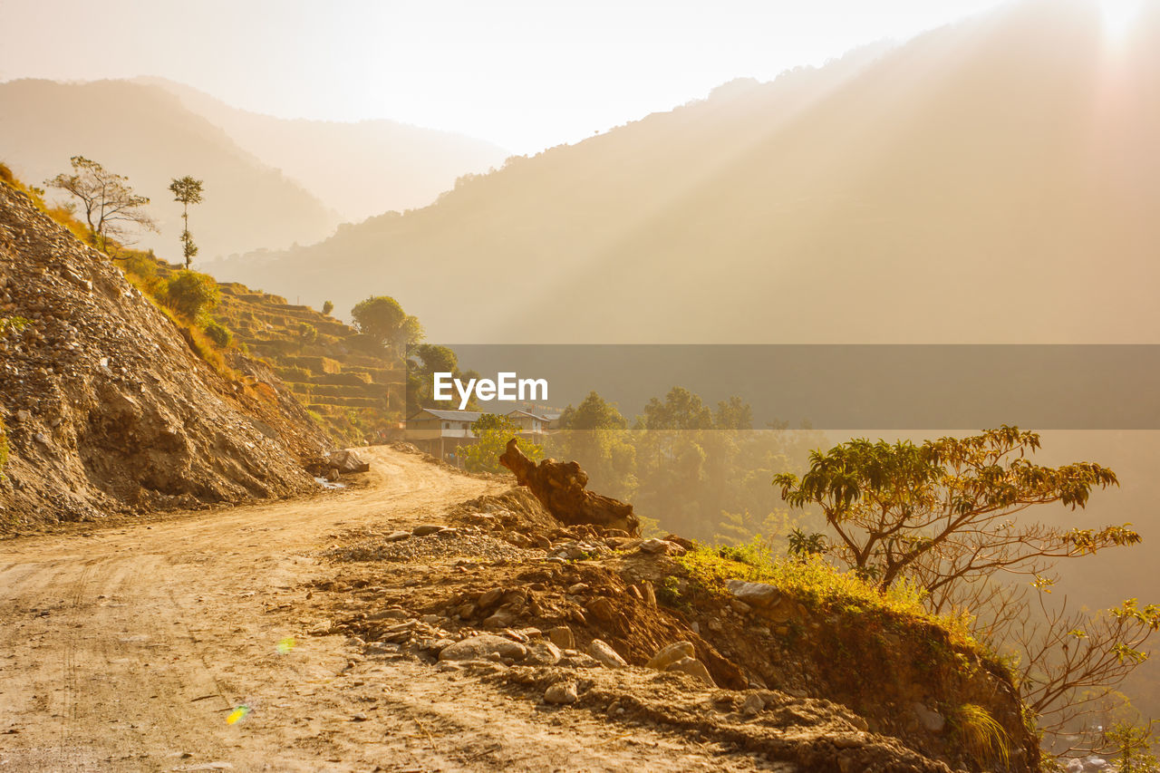 Scenic view of mountains against sky during foggy weather